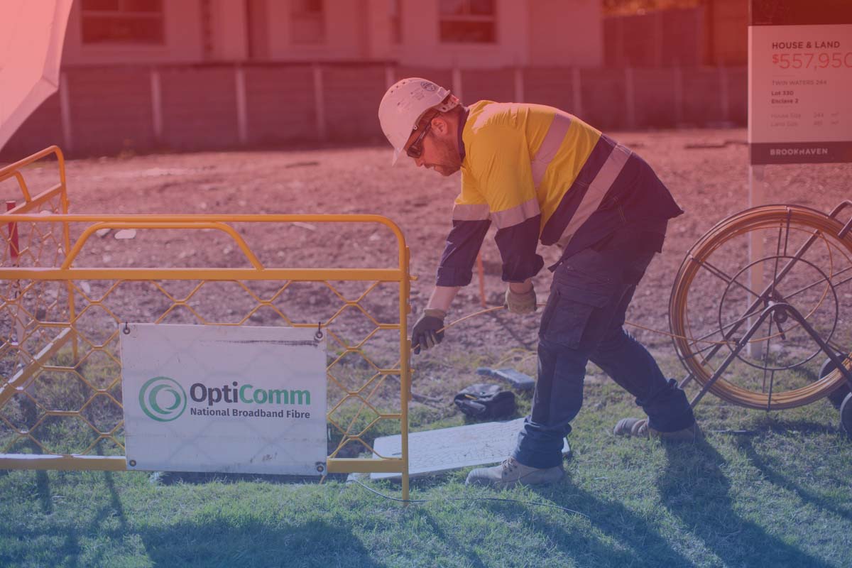 Opticomm maintenance technician performing ONT installation