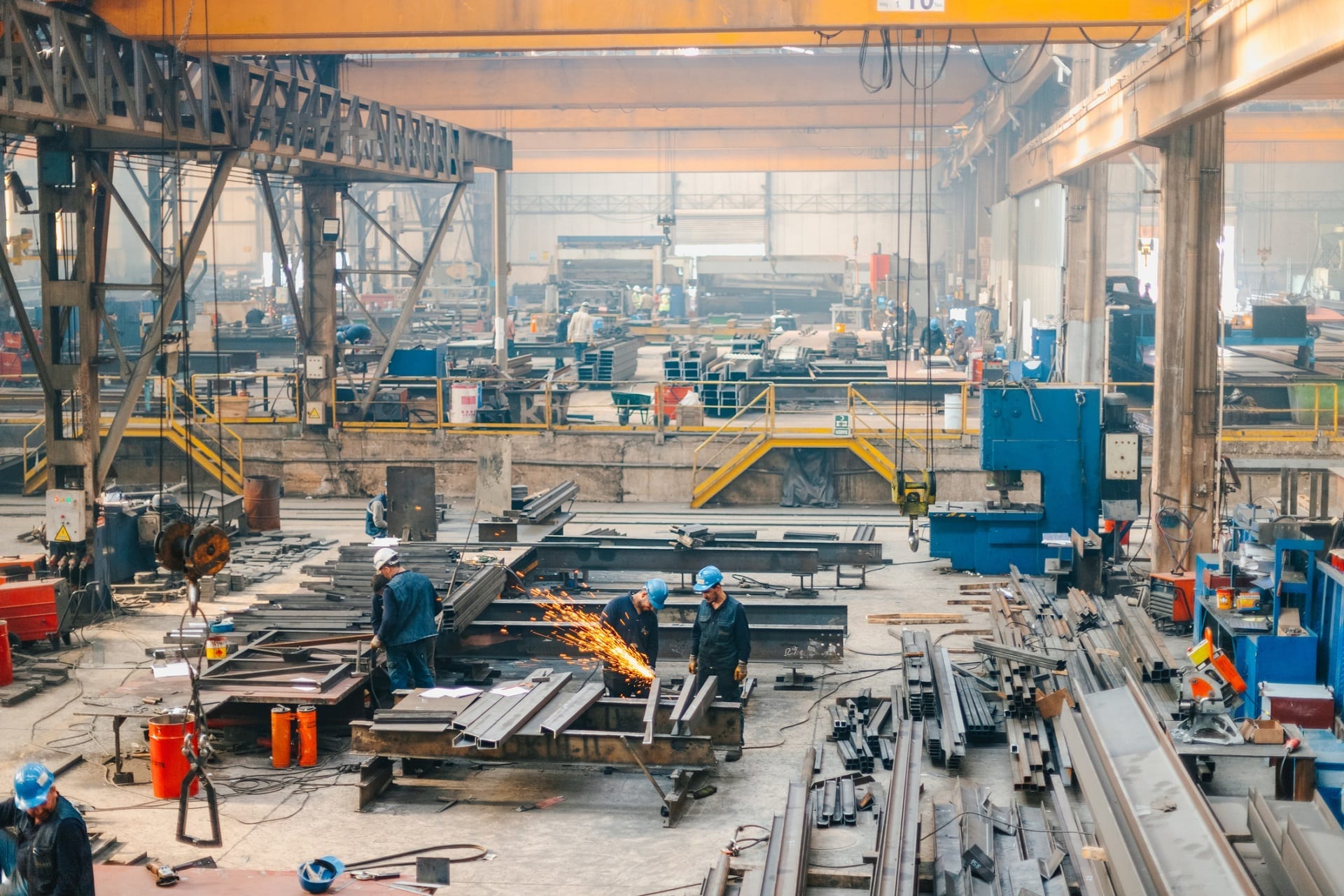 A distant view of manufacturing site with working technicians