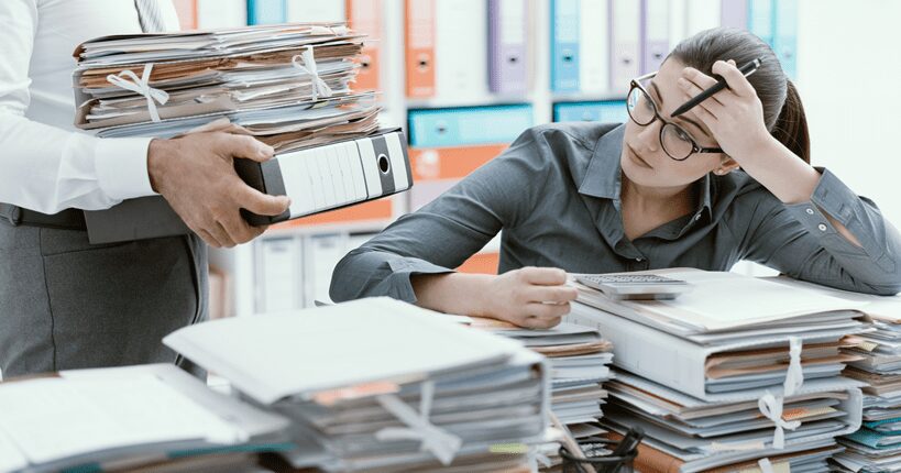 tired woman doing paperwork