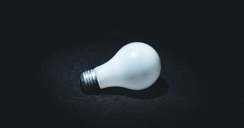 white lightbulb on a black background
